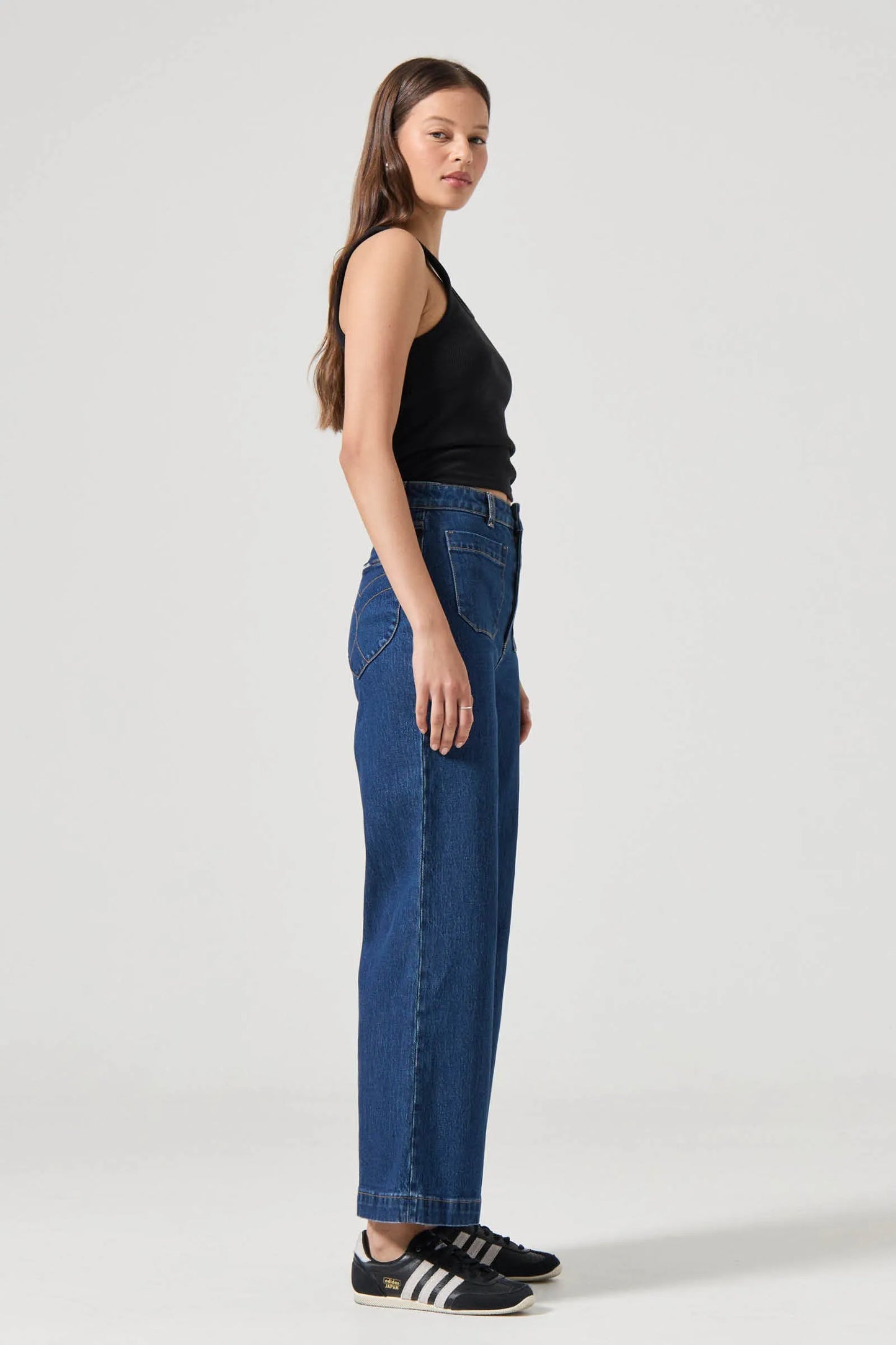 This is a super high-rise, wide leg jean, made with a comfort rigid denim. Fits true to size.
The Sailor Jean:
High rise, slim fit with a sailor wide leg
Fits smaller in the waist to eliminate gaps at the back waistband
Features Rolla's signature back pockets & sailor style patch front pockets
Specially angled and shaped in the back for a truly peachy looking butt
Comfort rigid denim which gives you the look of a vintage jean but the comfort of stretch
Zip closure
Made with vintage gold toned hardware