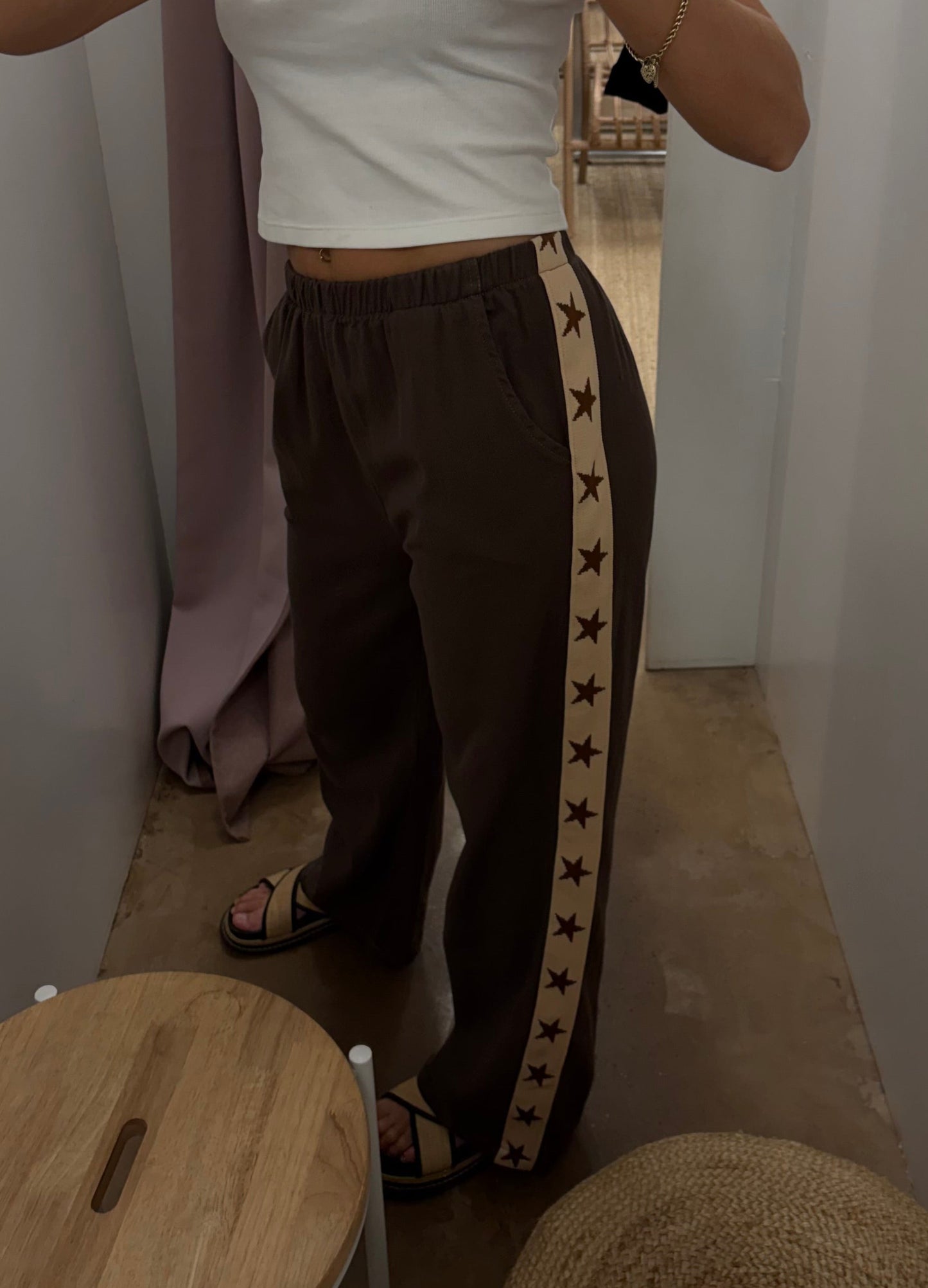 Star Racer Pants - By Frankie
Details
Make a statement with the Star Racer Pants in chocolate brown and cream stripe. The high-waisted silhouette features an elasticated waistband and front tie detail for a flattering fit. Practical side pockets and a straight leg cut complete the look.
Product Details:
High waisted
Elasticated waist band
Front tie detail
Side pockets
Straight leg fit
Race stripe detail on side seams