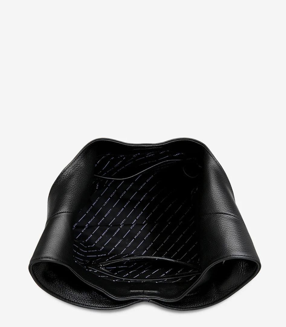 Solstice Bag - Black - Status Anxiety
Relaxed yet reliable, 'Solstice' is a slouchy tote that carries more than it lets on (including a 13-inch laptop). Soft, spacious, and closed with the snap of a magnet, 'Solstice' is unstructured and easygoing in all the right ways.
Soft shrunken pebble leather
Internal zipper pocket, lipstick pocket, and open pouch pocket
Fits a 13-inch laptop
Magnet closure
Custom Status Anxiety lining
Comes in a Status Anxiety branded drawstring bag