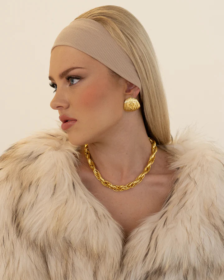 Can we have a moment for the Cameron Earrings… Think sophistication with all the drama. She is a fresh take on vintage-inspired oversized studs and exudes classic elegance, the wide golden shield boasts a high polished ridged texture and our favourite heart motif, she truly has it all! Day or night the Cameron earrings will have you feeling like the chicest woman in the room.