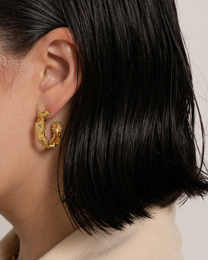 Cute, fun, fresh, floral, easy, breezy, beautiful! The Kareena earrings have become everyone's favourite little hoop to accessorise any outfit and bring some sunshine to every day. With glittering Citrine gemstones that capture the light and have you feeling your happiest. Every MM girl needs the Kareena's in their jewellery collection. 