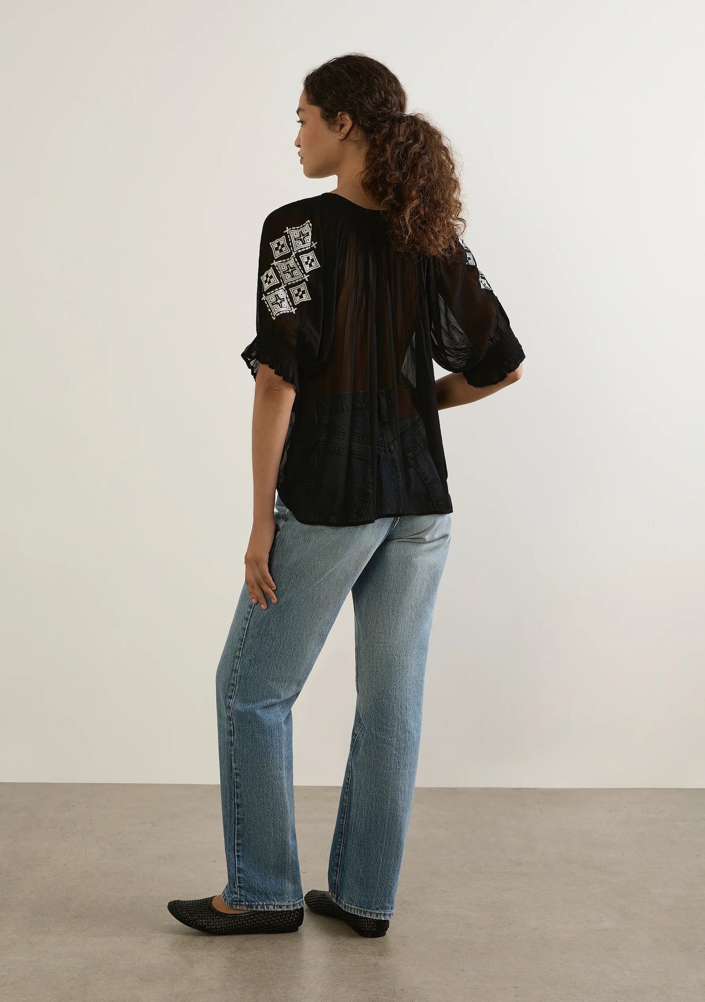 Romantic, floaty, and just a little bit vintage, this is the blouse that does it all.
Meet your new go-to blouse for effortless romance and vintage charm. The Stevie Embroidered Blouse by Auguste The Label in black is crafted from softly draped viscose georgette, giving it a semi-sheer, fluid finish that moves beautifully with you. The flattering V-neckline with an optional tie adds a touch of versatility, while delicate shirring around the neckline creates subtle texture that feels both refined and relaxe