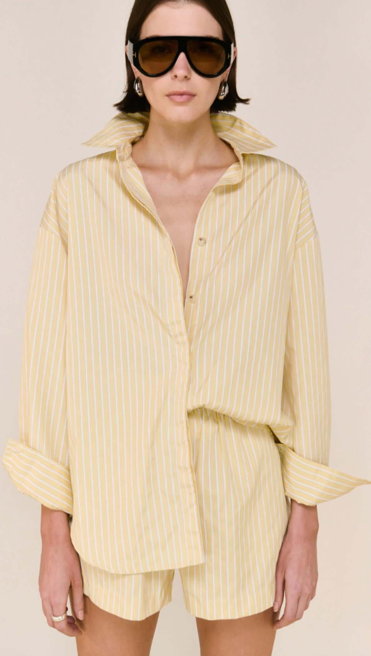 Sunshine in a Shirt.
Meet the Zeno Butter Yellow Striped Shirt from Staple The Label, your new go-to for effortless, everyday polish with zero fuss. Lightweight, breezy, and oh-so-soft, this relaxed-fit shirt drapes beautifully, giving you that put-together vibe while keeping things easy and comfortable.
With subtle yellow-and-white stripes and a classic button-through front, it’s the kind of shirt you can wear loose, half-tucked, or layered for a fresh, modern take on warm-weather dressing. Pair it with
