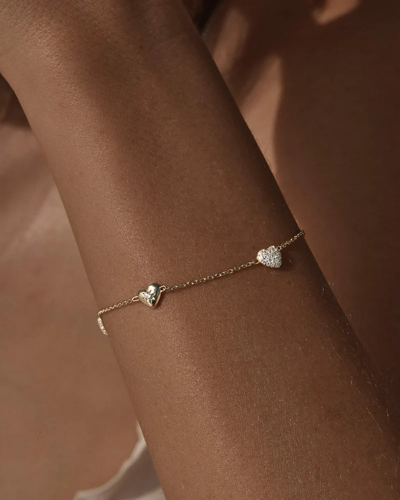 The You Have My Heart Charm Bracelet is a joyful and sparkling proclamation of love and connection, re-imagining the heart motif into a playful charm design featuring alternating crystal encrusted pendants. Wear this design as a reminder of the love that surrounds, enriches, and strengthens you every day.
18k Gold Vermeil: 2.5 microns of 18 carat gold coating a sterling silver base.
Features sparkling cubic zirconias in claw and pavé settings.
Bracelet length: 19cm.
Features a s