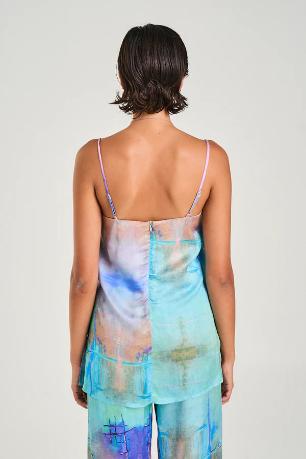 Breezy, Artsy, and Effortlessly Chic
Step into effortless style with the Summi Summi Tunic Top – H20, your new go-to for relaxed, warm-weather vibes. Crafted from a luxuriously soft viscose-rayon blend, this tunic drapes beautifully, moving with you for all-day comfort. The straight-cut bodice and adjustable straps let you tailor the fit, while playful side slits add a hint of movement and fun with every step. Whether layered over your favourite shorts or worn on its own, it’s a versatile piece that’s equa