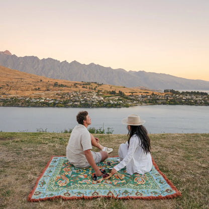 Jade Picnic Rug - Isla 

Introducing the Jade picnic rug - your bohemian escape beneath open skies. Unroll it on the grass, pour a glass, and let its stunning floral details set the scene for an unforgettable day. Perfect for sunset picnics by the lake, self-care moments in the park, or draped at home as a cozy throw.

- Made with 100% cotton

- One-colour tassel trim around the rug

- Extra large picnic rug - approx 200 x 160cm which comfortably fits 4 people 