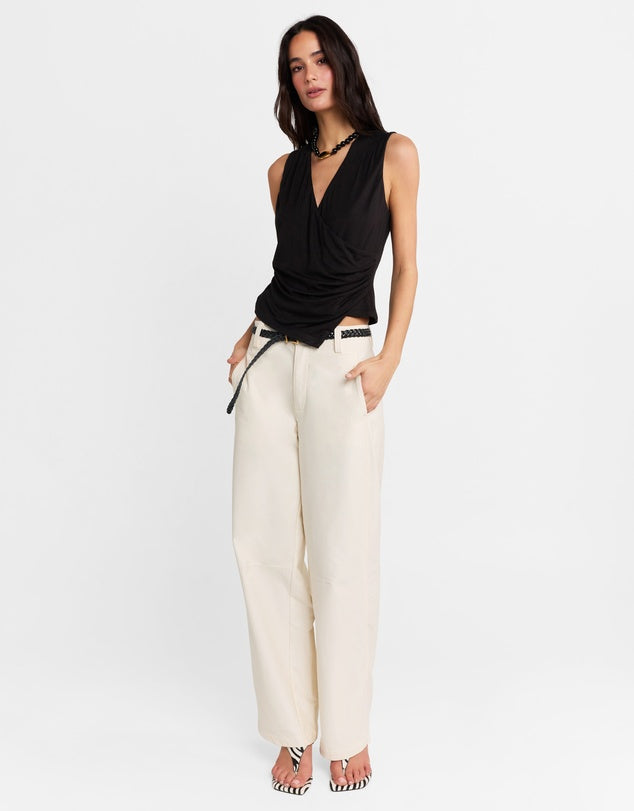 Elevate your wardrobe with the Jenkins Top from Madison The Label. A chic V-neck jersey top featuring a draped wrap front and an asymmetric hem. This top offers a flattering and stylish fit that's both comfortable and stylish. Perfect for pairing with everything from tailored trousers to your favorite jeans, it’s versatile enough for both work and weekend looks.

Hope is wearing a size small. She is 180cm (5'11) tall, has an 76cm bust, 58cm waist and 89cm hips.
