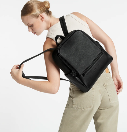 If you call - Black - Status Anxiety 
The archetypal backpack is made to improve your everyday carry. Constructed with comfort and looks in mind and crammed with functionality. The 'If You Call' backpack is perfect for your next last-minute tryst.

Soft shrunken pebble leather
Front zipper pocket, and open side pockets
Internal zipper pocket, and open pouch pockets
Zipper close
Padded shoulder strap
Matte black hardware
Fits a 13 inch MacBook
Custom Status Anxiety lining