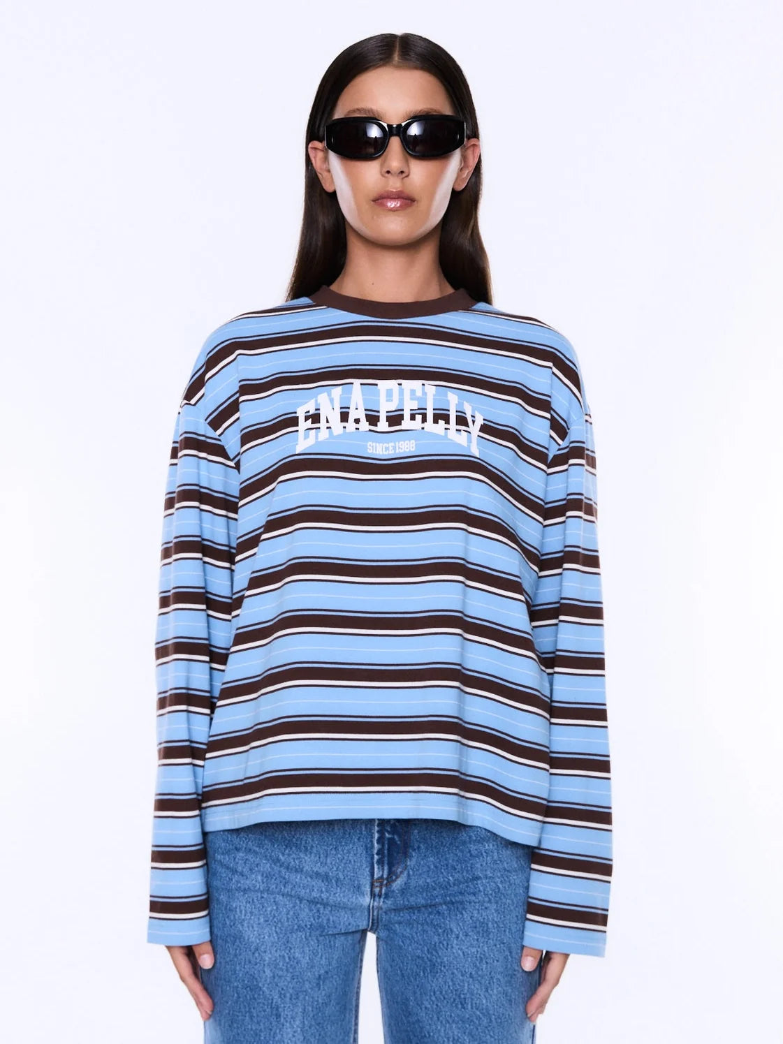 Soft Texture. Confident Mood.
The Maria Boxy Long Sleeve from Ena Pelly is crafted from cotton with a relaxed boxy silhouette that feels effortless and versatile. Finished with collegiate-inspired graphics, contrast white print detailing and bold striped fabric, creating a playful balance of sport and streetwear influences.
