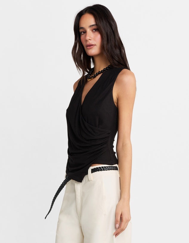 Elevate your wardrobe with the Jenkins Top from Madison The Label. A chic V-neck jersey top featuring a draped wrap front and an asymmetric hem. This top offers a flattering and stylish fit that's both comfortable and stylish. Perfect for pairing with everything from tailored trousers to your favorite jeans, it’s versatile enough for both work and weekend looks.

Hope is wearing a size small. She is 180cm (5'11) tall, has an 76cm bust, 58cm waist and 89cm hips.