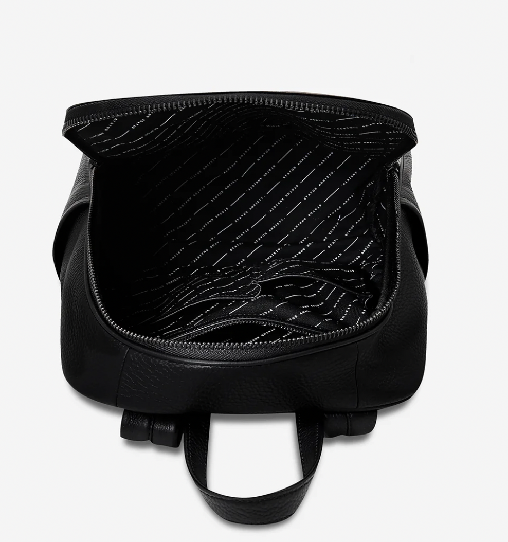 If you call - Black - Status Anxiety 
The archetypal backpack is made to improve your everyday carry. Constructed with comfort and looks in mind and crammed with functionality. The 'If You Call' backpack is perfect for your next last-minute tryst.

Soft shrunken pebble leather
Front zipper pocket, and open side pockets
Internal zipper pocket, and open pouch pockets
Zipper close
Padded shoulder strap
Matte black hardware
Fits a 13 inch MacBook
Custom Status Anxiety lining