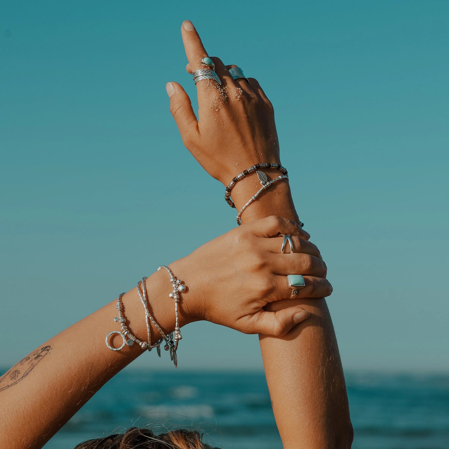 Discover the Bamboo Sea Bracelet, meticulously handcrafted with Hill Tribe Silver and adorned with a polywax cotton band. Symbolising growth and harmony with nature, this bracelet's organic texture and vibrant colours serve as a daily reminder of your connection to the natural world. Experience boho-inspired elegance with Embella's Bamboo Bracelet.