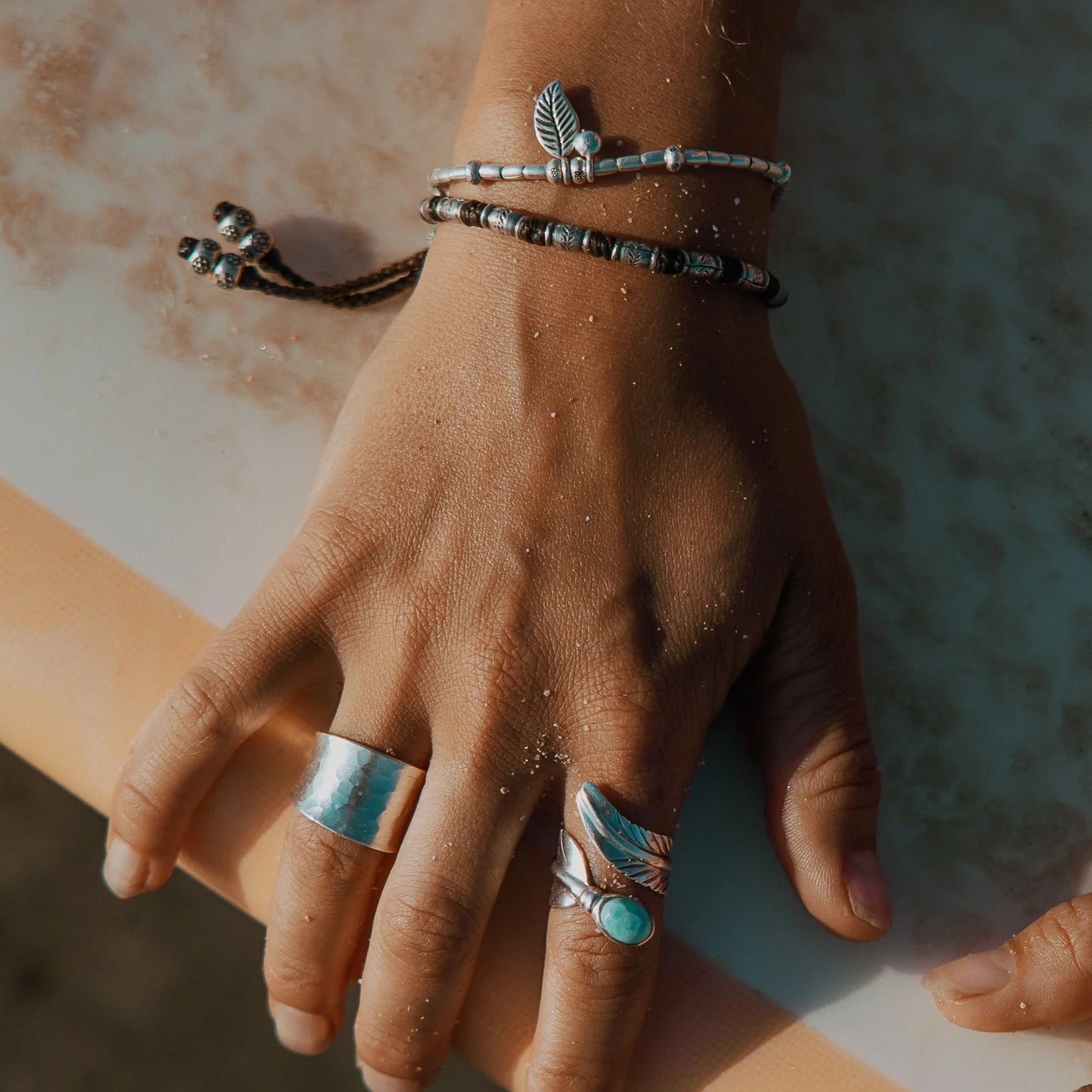Discover the Bamboo Sea Bracelet, meticulously handcrafted with Hill Tribe Silver and adorned with a polywax cotton band. Symbolising growth and harmony with nature, this bracelet's organic texture and vibrant colours serve as a daily reminder of your connection to the natural world. Experience boho-inspired elegance with Embella's Bamboo Bracelet.