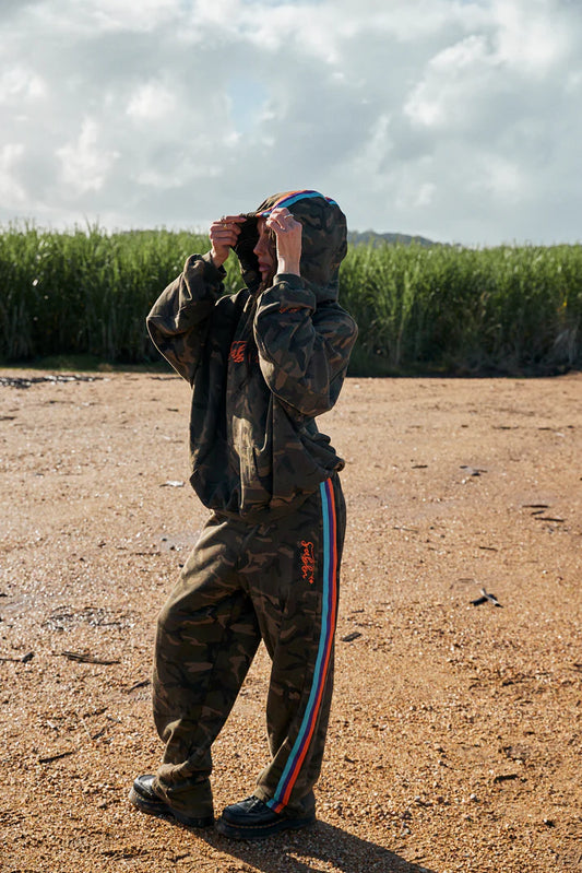YOU HAVE ALWAYS BEEN ENOUGH!


Stand out in our 100% cotton camo trackpants.
A relaxed fit barrel leg pant with a drawstring waist, two side pockets and woven taped down both leg. These pants gonna get you through the colder months in style.