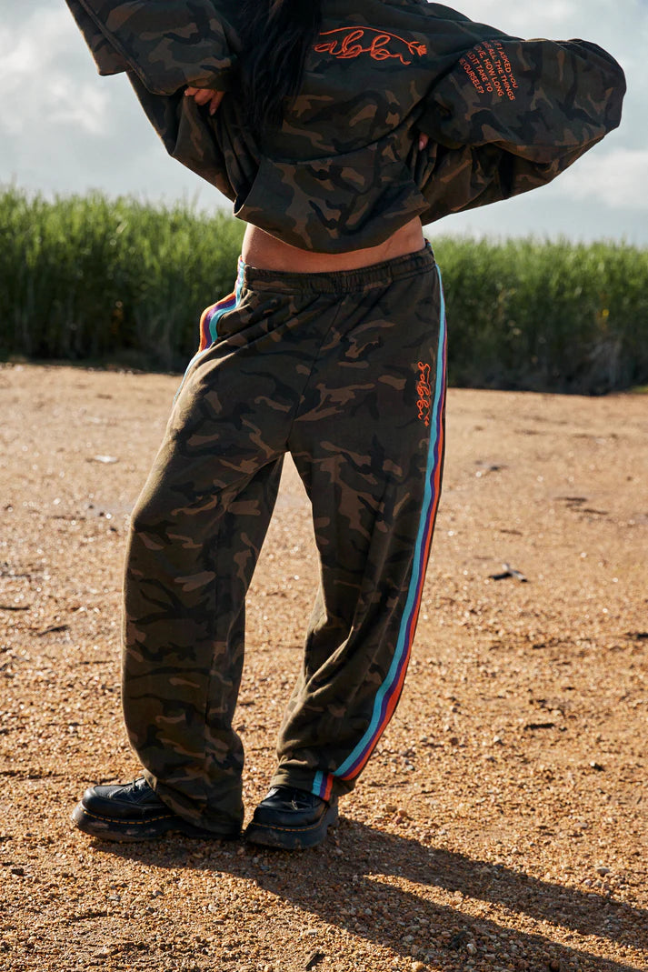 YOU HAVE ALWAYS BEEN ENOUGH!


Stand out in our 100% cotton camo trackpants.
A relaxed fit barrel leg pant with a drawstring waist, two side pockets and woven taped down both leg. These pants gonna get you through the colder months in style.