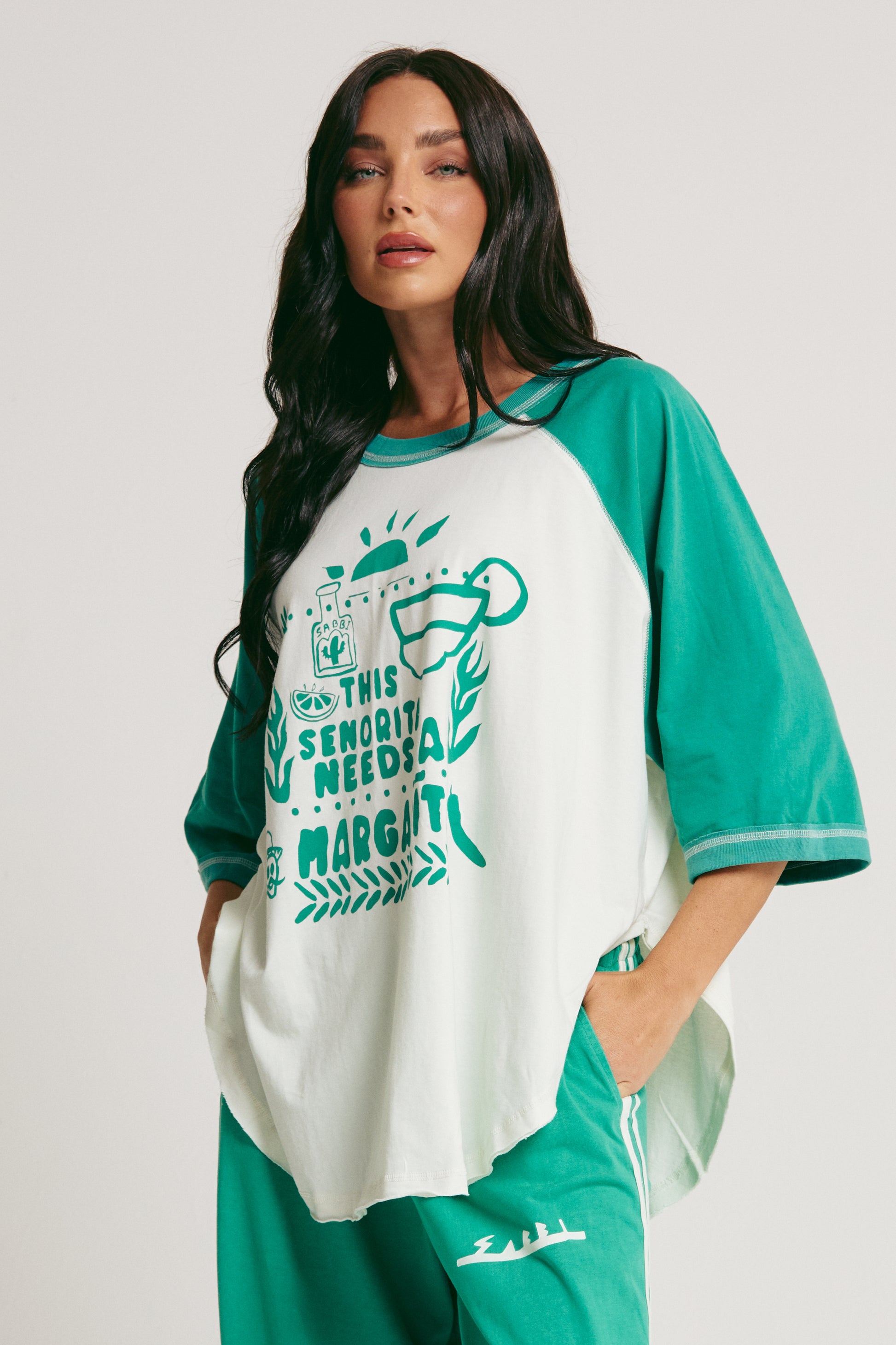 Salt in the air. No plans. Just vibes. 

Meet the Sabbi Raglan Margie Tee, your go-to for slow mornings, sunset hangs, and those “just one more” kind of nights. With a relaxed, oversized raglan fit, this tee drapes effortlessly, feeling as easy on the body as it looks on you.

Made from soft, breathable cotton, it’s lightweight enough to keep you cool but cozy enough to lounge in all day. The contrast raglan sleeves and curved hem give it that perfectly undone, throw-on-and-go energy, while the playful