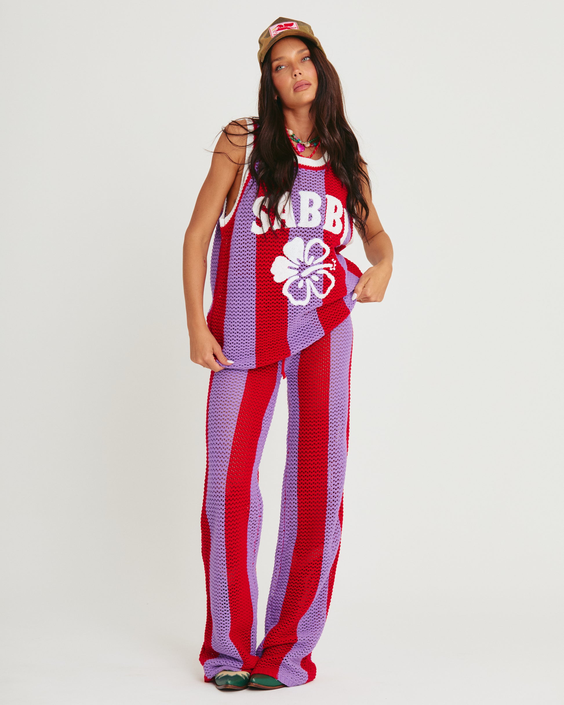 Courtside Energy, Unapologetically Bold

Make every moment a statement with the SABBI Knit B-Ball Singlet – Purple Stripe. Retro-sport vibes meet artisanal crochet in this eye-catching piece, designed for anyone who loves to stand out. Vibrant purple and fiery red stripes, breathable open-weave construction, and an oversized, relaxed fit make it festival-ready, beach-perfect, and effortlessly iconic.