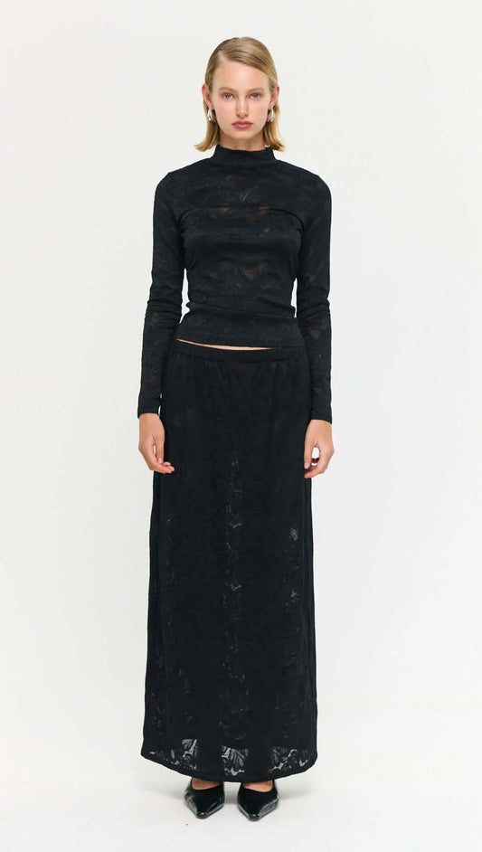 The Sheer Lace Maxi Skirt brings a modern, textural edge to occasion and everyday dressing.