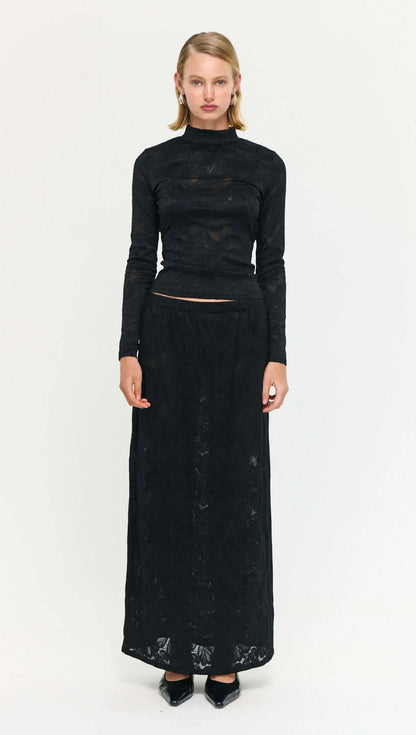 The Black Sheer Lace Long Sleeve Top offers a refined take on elevated layering.
