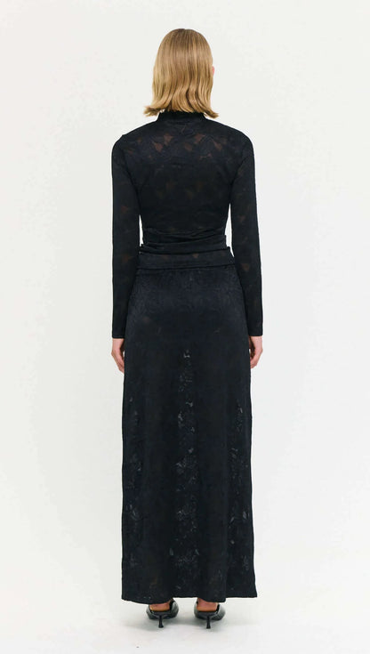 The Black Sheer Lace Long Sleeve Top offers a refined take on elevated layering.