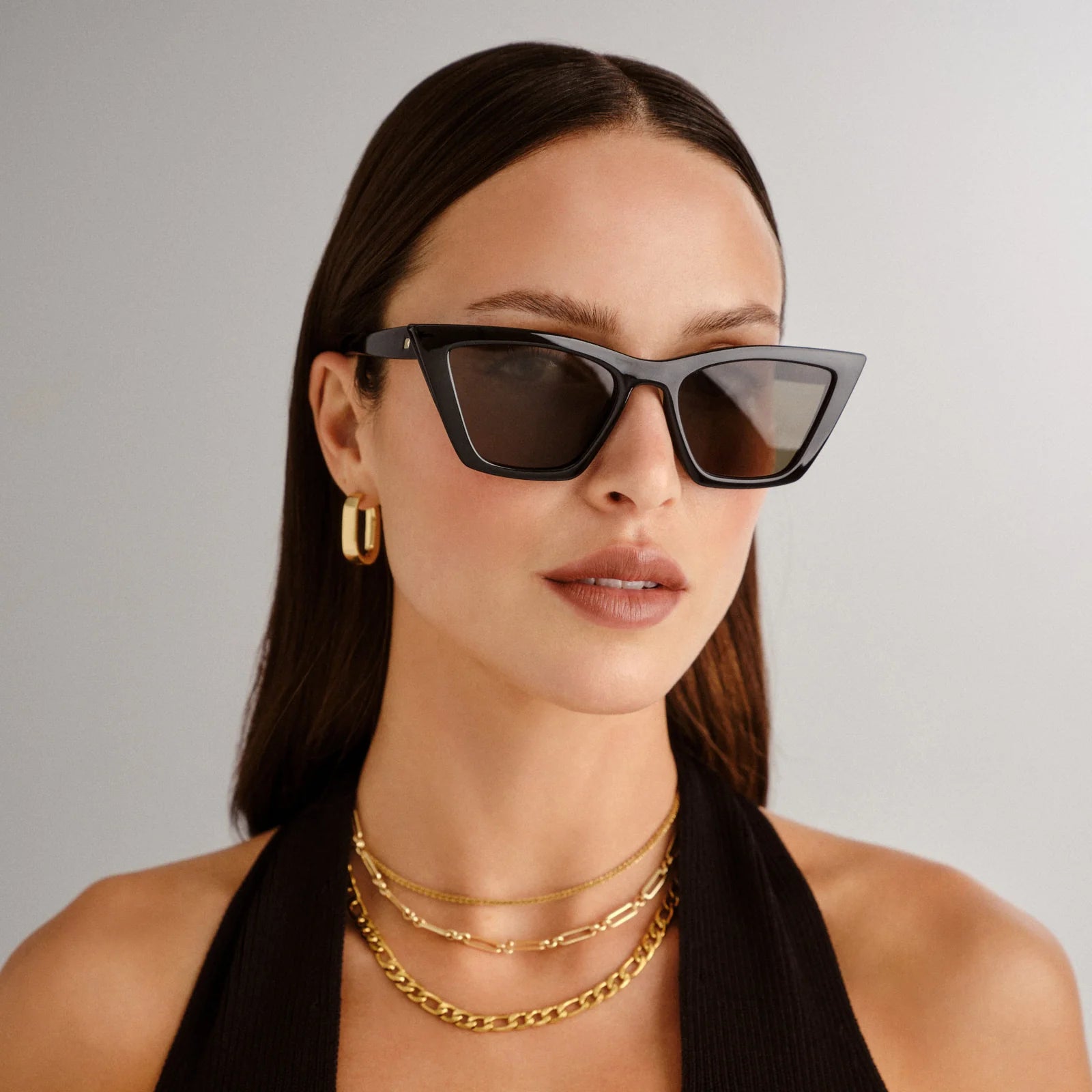 Featuring sweeping lines and refined proportions, our VELODROME sunglasses are an invariable classic. Designed with a midsized fit and chic signature pinstripe metal hardware on both temples, this refined cat-eye style is suitable for all face shapes and will look sharp with any outfit.

• Finished in classic black with dark lenses for an everyday look.
• Made using BPA free polymer plastic which is lightweight, durable and impact resistant.
• Fitted with shatterproof and scratch resistant polycarbonate len
