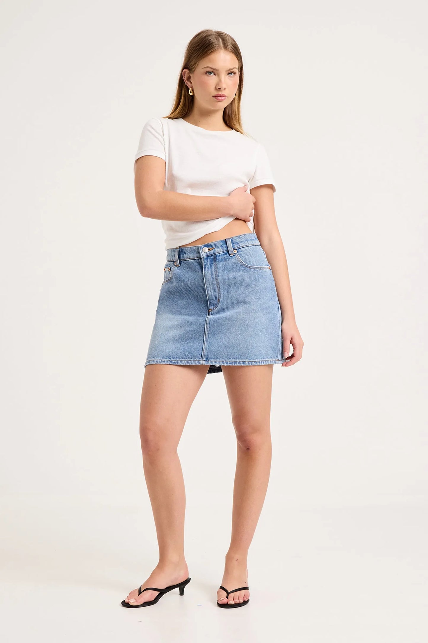 90's Relaxed Mini Skirt by ROLLAS

90’s Relaxed Mini Skirt is a mid-rise mini skirt with a relaxed, easy fit
Designed to sit comfortably on the waist, and finishes at mid-thigh
Will soften and mould to the body over time
Combines nostalgic 90’s styling with everyday wearability
Made with Rolla's signature vintage trims
Button fly closure