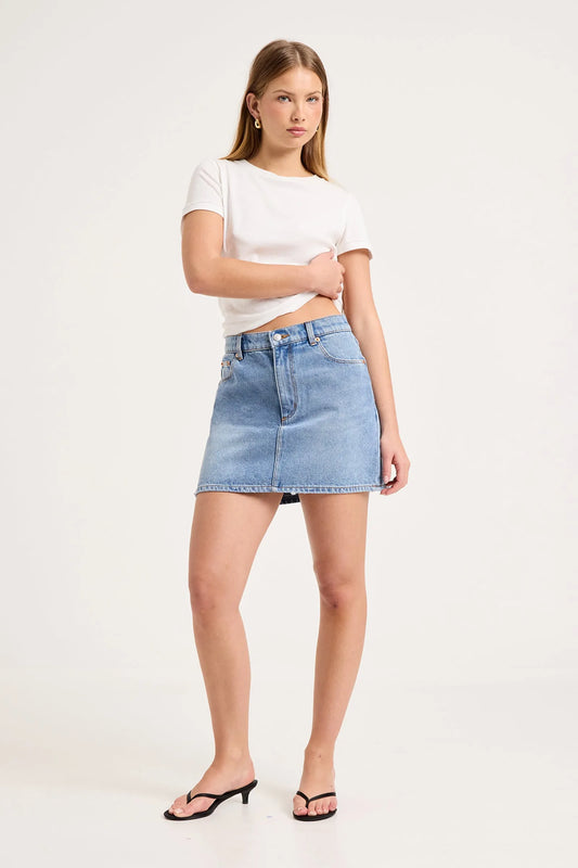 90's Relaxed Mini Skirt by ROLLAS

90’s Relaxed Mini Skirt is a mid-rise mini skirt with a relaxed, easy fit
Designed to sit comfortably on the waist, and finishes at mid-thigh
Will soften and mould to the body over time
Combines nostalgic 90’s styling with everyday wearability
Made with Rolla's signature vintage trims
Button fly closure