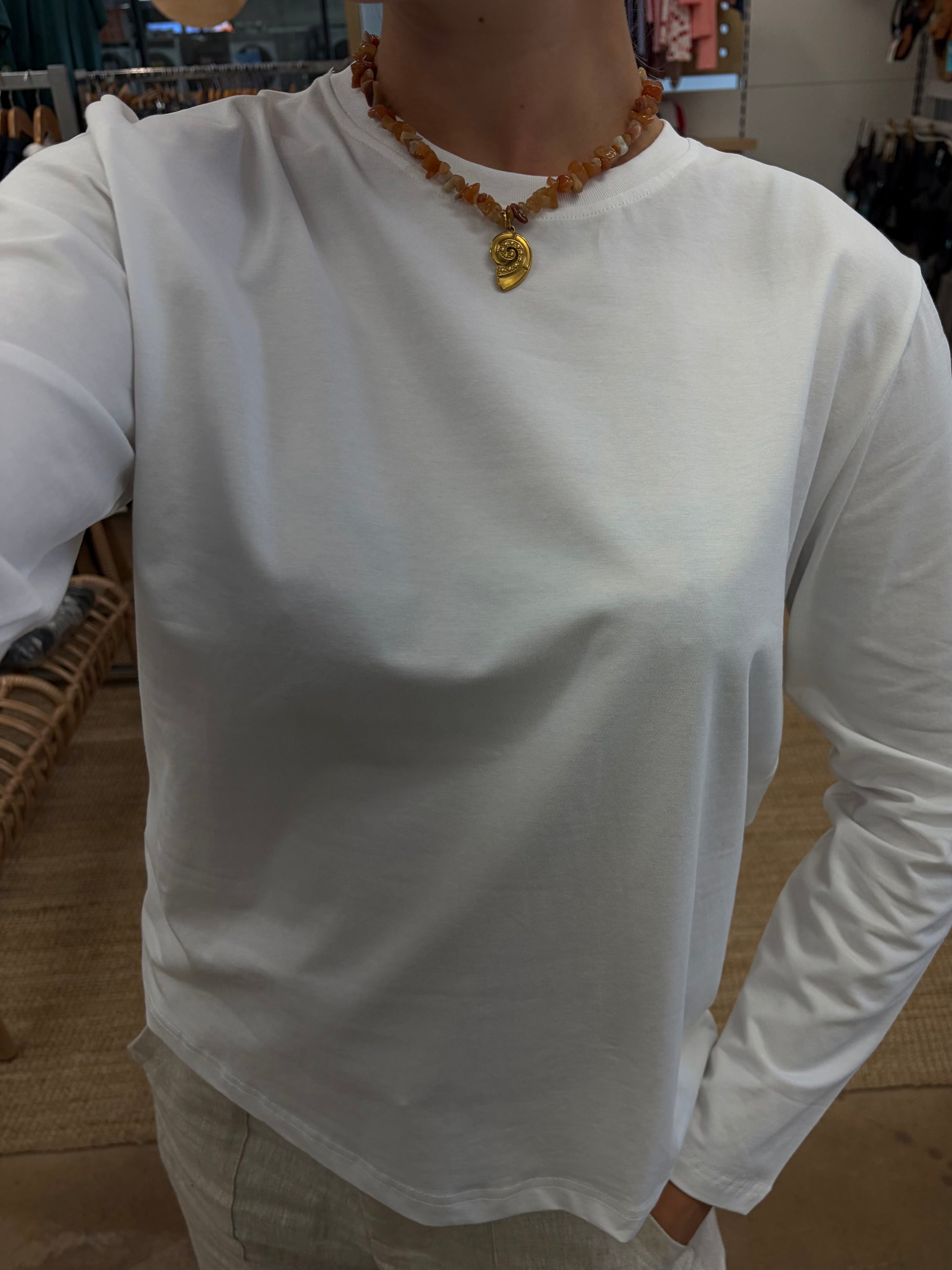 Athena Long Sleeve - White - Little Lies 

The Athena Stripe, a long-sleeved basic tee evolved from our best-selling Athens and Rhodes styles, is crafted from a soft cotton/spandex blend with a round neckline, straight hemline, and hemmed long sleeves, offering a buttery feel and perfect stretch for all-day comfort.

FEATURES:

Round neckline
Straight hemline
Hemmed long sleeve
FABRIC: 100% Cotton