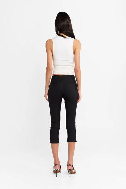 Introducing the Camille Top by Madison The Label, an elegant twist to an everyday basic. This fitted top features a deep V neckline, contrast lace trim through neckline, and under bust seam detail with soft gathers. It is fully lined with a fitted silhouette, gathered waist detail, and it's crafted in a soft stretch fabrication. Pair with the Paloma Pants to complete the look.

Hope is wearing a size extra small. She is 180cm (5'11) tall, has an 76cm bust, 58cm waist and 89cm hips.