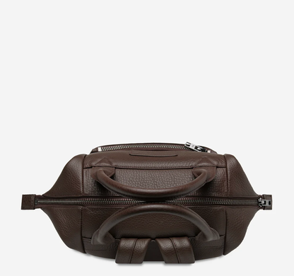 Mini waves Cocoa - Status Anxiety 

Made in response to the (very) popular request to make a smaller size version of our best selling 'Comes In Waves' bag. Mini Waves is the perfect uni or work bag with a wide opening top, space for your laptop and multiple compartments to keep everything in its place. Carry in hand with the top straps, over the body with the long webbed strap (included), or on your back with the shoulder straps. Big enough to carry everything you need, not too big to slow you down.