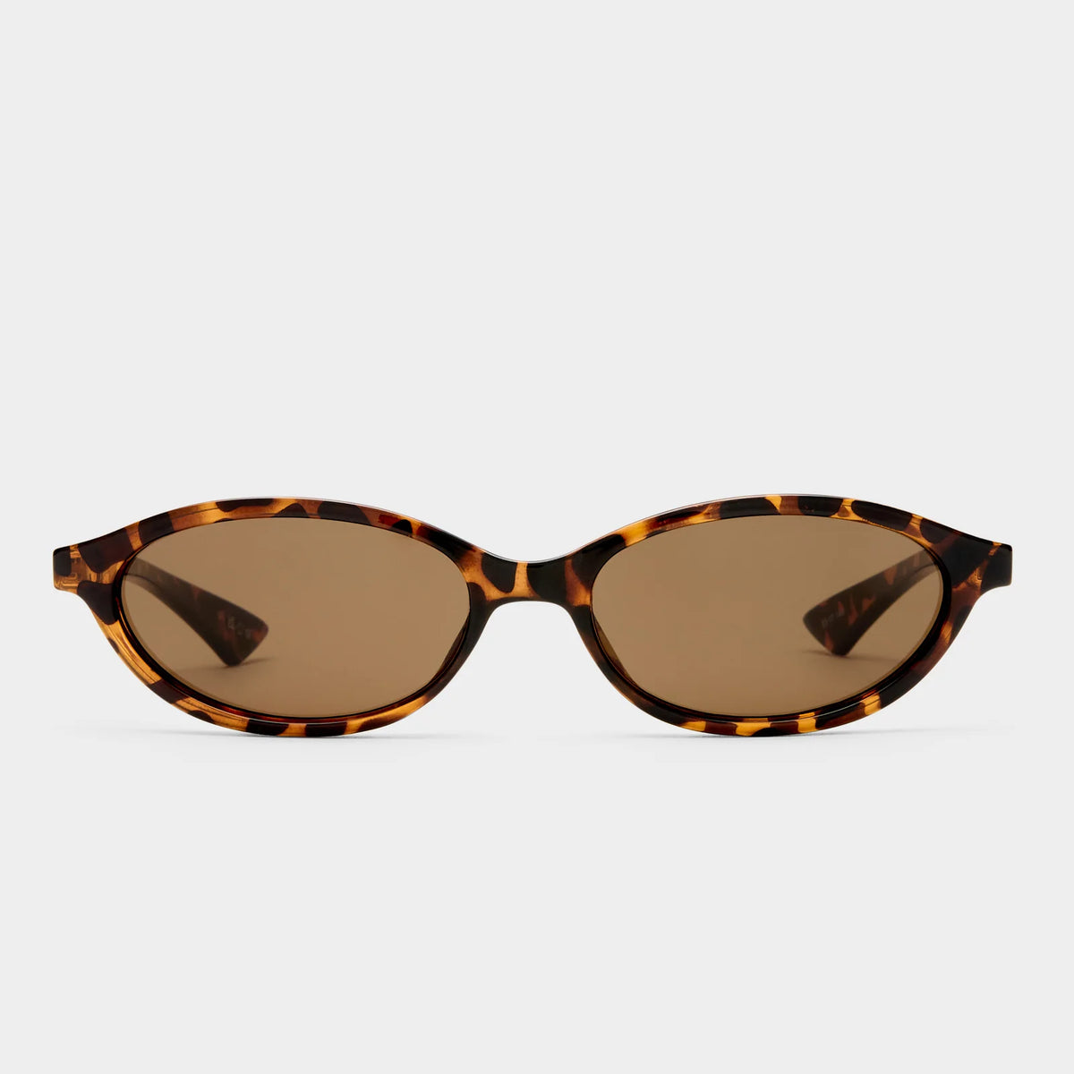 Channel early ‘90s nostalgia with DUSKFALL, a sleek slimline oval frame designed for a bold yet effortless statement. Inspired by vintage silhouettes, this refined design features smooth curves, polished accents, and a streamlined fit, making it the perfect balance of classic and contemporary.

• Finished in a tort frame with brown mono lenses.
• A lightweight, durable and impact resistant polycarbonate frame.
• Fitted with shatterproof and scratch resistant polycarbonate lenses.