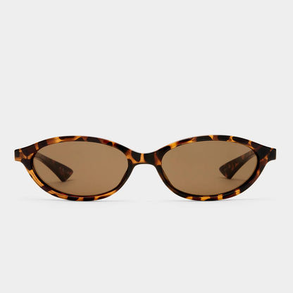 Channel early ‘90s nostalgia with DUSKFALL, a sleek slimline oval frame designed for a bold yet effortless statement. Inspired by vintage silhouettes, this refined design features smooth curves, polished accents, and a streamlined fit, making it the perfect balance of classic and contemporary.

• Finished in a tort frame with brown mono lenses.
• A lightweight, durable and impact resistant polycarbonate frame.
• Fitted with shatterproof and scratch resistant polycarbonate lenses.