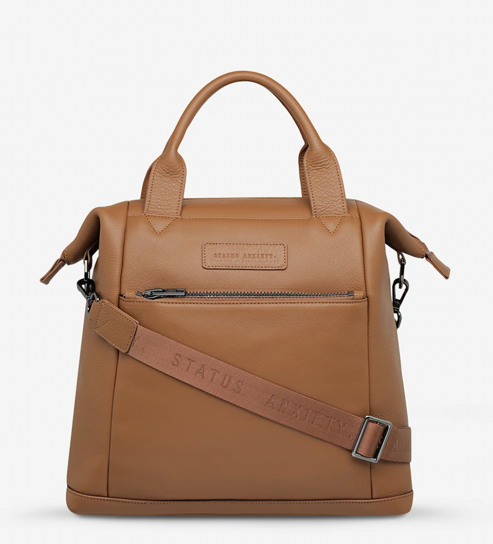 Mini waves Camel - Status Anxiety 

Made in response to the (very) popular request to make a smaller size version of our best selling 'Comes In Waves' bag. Mini Waves is the perfect uni or work bag with a wide opening top, space for your laptop and multiple compartments to keep everything in its place. Carry in hand with the top straps, over the body with the long webbed strap (included), or on your back with the shoulder straps. Big enough to carry everything you need, not too big to slow you down.
