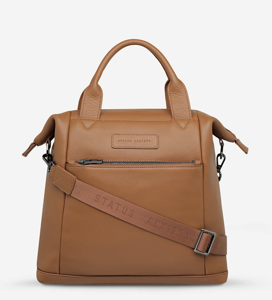 Mini waves Camel - Status Anxiety 

Made in response to the (very) popular request to make a smaller size version of our best selling 'Comes In Waves' bag. Mini Waves is the perfect uni or work bag with a wide opening top, space for your laptop and multiple compartments to keep everything in its place. Carry in hand with the top straps, over the body with the long webbed strap (included), or on your back with the shoulder straps. Big enough to carry everything you need, not too big to slow you down.