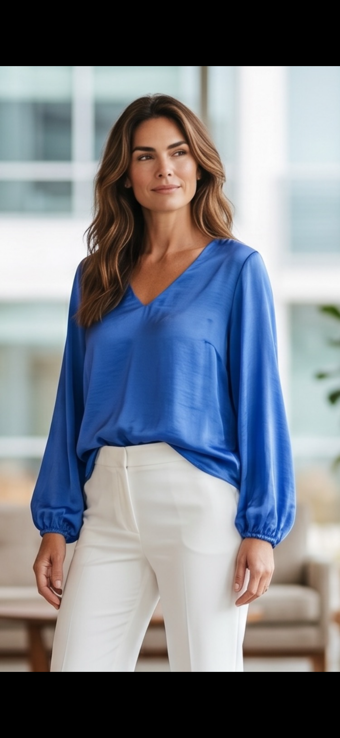 The Blue Blouse by Lemon & Salt features a royal blue colour with long sleeves and cuffed wrists. Crafted from a soft, lightweight, silky fabric, it offers comfort and breathability suitable for professional and casual settings.