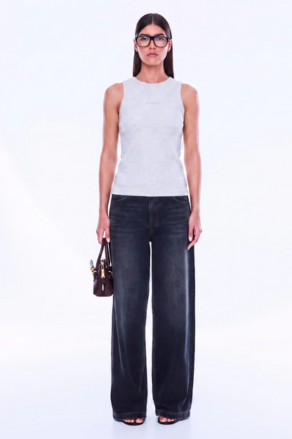 Soft Texture. Confident Mood. The Celine Tank is crafted in cotton with a fitted silhouette, using soft rib fabrication to create a streamlined oat marle base. Finished with a classic crew neckline and exclusive in-house stack print branding, tonal Ena Pelly detailing keeps the look understated and refined for an effortless everyday layer.