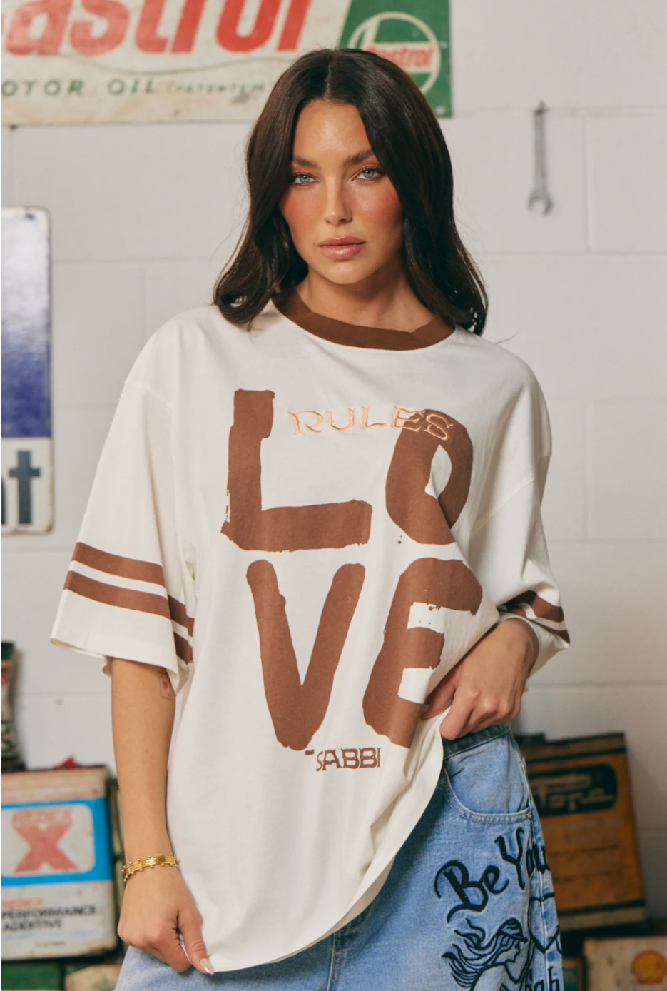 THE VERY OVERSIZED LOVE REVOLUTION TEE - OFF WHITE SABBI

IT'S A SABBI LOVE REVOLUTION!

The Very Oversized Love Revolution Tee is for rule-breakers, fun lovers and peeps who like their tees oversized and wear their hearts on their sleeves.

Designed in a very oversized, relaxed silhouette, this tee features a bold, hand-painted LOVE graphic front and REVOLUTION print on the back. With a contrast neckline and cool double stripes around the sleeve this tee is perfect for throwing on post-swim.