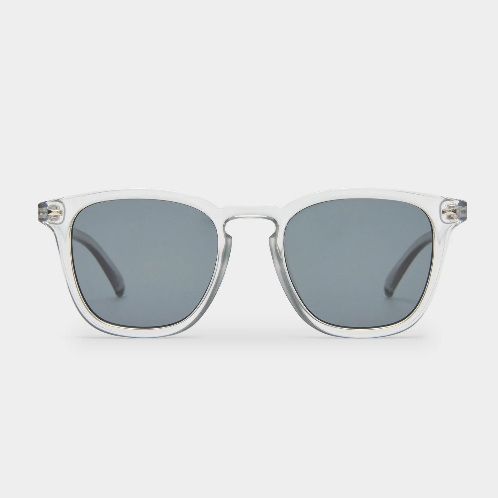 NO BIGGIE is a modern take on a fifties rectangular shape, offering the sharpest look of the season. Featuring classic rivet detailing, it combines bold style with timeless appeal.

• Finished in a crystal grey frame with dark lenses.
• Made using BPA free polymer plastic which is lightweight, durable and impact resistant.
• Fitted with shatterproof and scratch resistant polycarbonate lenses