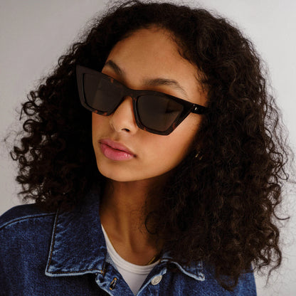 Featuring sweeping lines and refined proportions, our VELODROME sunglasses are an invariable classic. Designed with a midsized fit and chic signature pinstripe metal hardware on both temples, this refined cat-eye style is suitable for all face shapes and will look sharp with any outfit.

• Finished in a dark tortoiseshell frame with khaki gradient lenses.
• A lightweight, durable and impact resistant polycarbonate frame.
• Fitted with shatterproof and scratch resistant polycarbonate lenses.