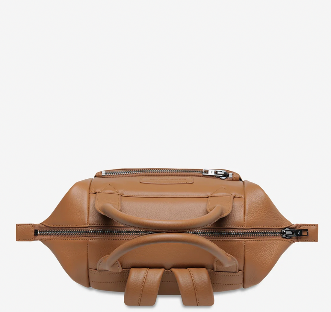 Mini waves Camel - Status Anxiety 

Made in response to the (very) popular request to make a smaller size version of our best selling 'Comes In Waves' bag. Mini Waves is the perfect uni or work bag with a wide opening top, space for your laptop and multiple compartments to keep everything in its place. Carry in hand with the top straps, over the body with the long webbed strap (included), or on your back with the shoulder straps. Big enough to carry everything you need, not too big to slow you down.