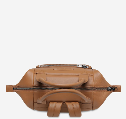 Mini waves Camel - Status Anxiety 

Made in response to the (very) popular request to make a smaller size version of our best selling 'Comes In Waves' bag. Mini Waves is the perfect uni or work bag with a wide opening top, space for your laptop and multiple compartments to keep everything in its place. Carry in hand with the top straps, over the body with the long webbed strap (included), or on your back with the shoulder straps. Big enough to carry everything you need, not too big to slow you down.