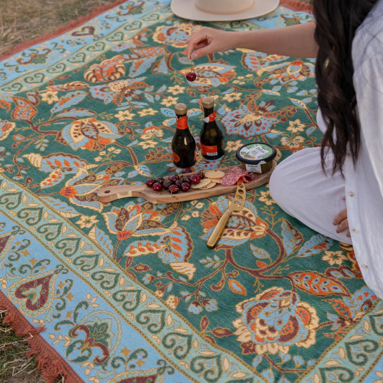 Jade Picnic Rug - Isla 

Introducing the Jade picnic rug - your bohemian escape beneath open skies. Unroll it on the grass, pour a glass, and let its stunning floral details set the scene for an unforgettable day. Perfect for sunset picnics by the lake, self-care moments in the park, or draped at home as a cozy throw.

- Made with 100% cotton

- One-colour tassel trim around the rug

- Extra large picnic rug - approx 200 x 160cm which comfortably fits 4 people 