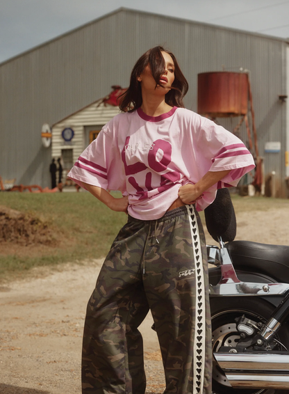 THE VERY OVERSIZED LOVE REVOLUTION TEE - PINK SABBI

IT'S A SABBI LOVE REVOLUTION!

The Very Oversized Love Revolution Tee is for rule-breakers, fun lovers and peeps who like their tees oversized and wear their hearts on their sleeves.

Designed in a very oversized, relaxed silhouette, this tee features a bold, hand-painted LOVE graphic front and REVOLUTION print on the back. With a contrast neckline and cool double stripes around the sleeve this tee is perfect for throwing on post-swim.
