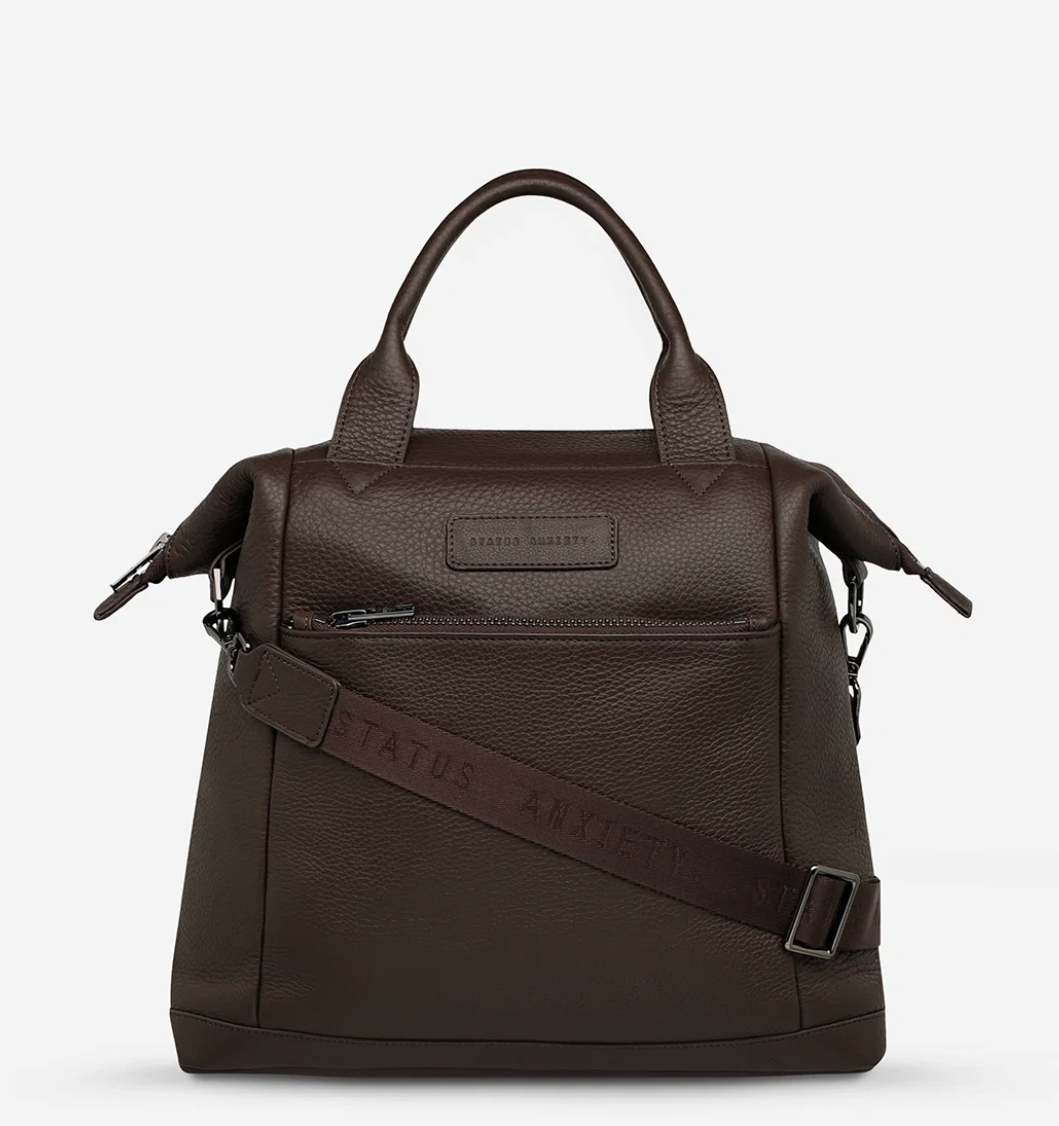 Mini waves Cocoa - Status Anxiety 

Made in response to the (very) popular request to make a smaller size version of our best selling 'Comes In Waves' bag. Mini Waves is the perfect uni or work bag with a wide opening top, space for your laptop and multiple compartments to keep everything in its place. Carry in hand with the top straps, over the body with the long webbed strap (included), or on your back with the shoulder straps. Big enough to carry everything you need, not too big to slow you down.