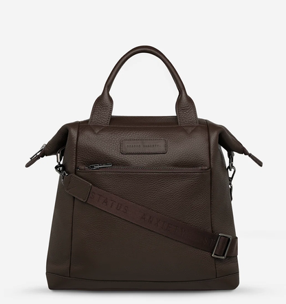 Mini waves Cocoa - Status Anxiety 

Made in response to the (very) popular request to make a smaller size version of our best selling 'Comes In Waves' bag. Mini Waves is the perfect uni or work bag with a wide opening top, space for your laptop and multiple compartments to keep everything in its place. Carry in hand with the top straps, over the body with the long webbed strap (included), or on your back with the shoulder straps. Big enough to carry everything you need, not too big to slow you down.