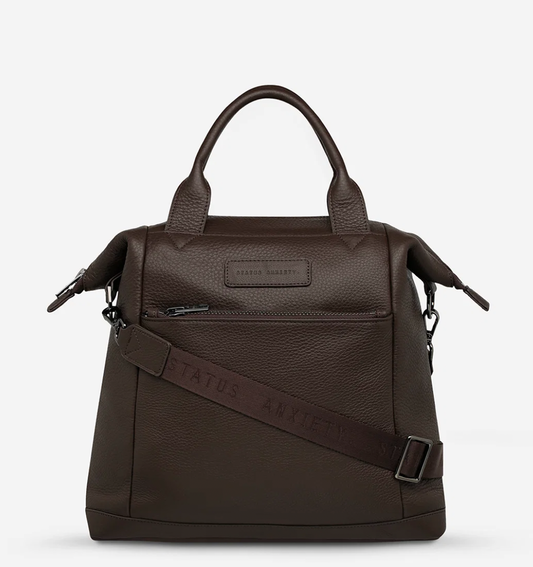 Mini waves Cocoa - Status Anxiety 

Made in response to the (very) popular request to make a smaller size version of our best selling 'Comes In Waves' bag. Mini Waves is the perfect uni or work bag with a wide opening top, space for your laptop and multiple compartments to keep everything in its place. Carry in hand with the top straps, over the body with the long webbed strap (included), or on your back with the shoulder straps. Big enough to carry everything you need, not too big to slow you down.