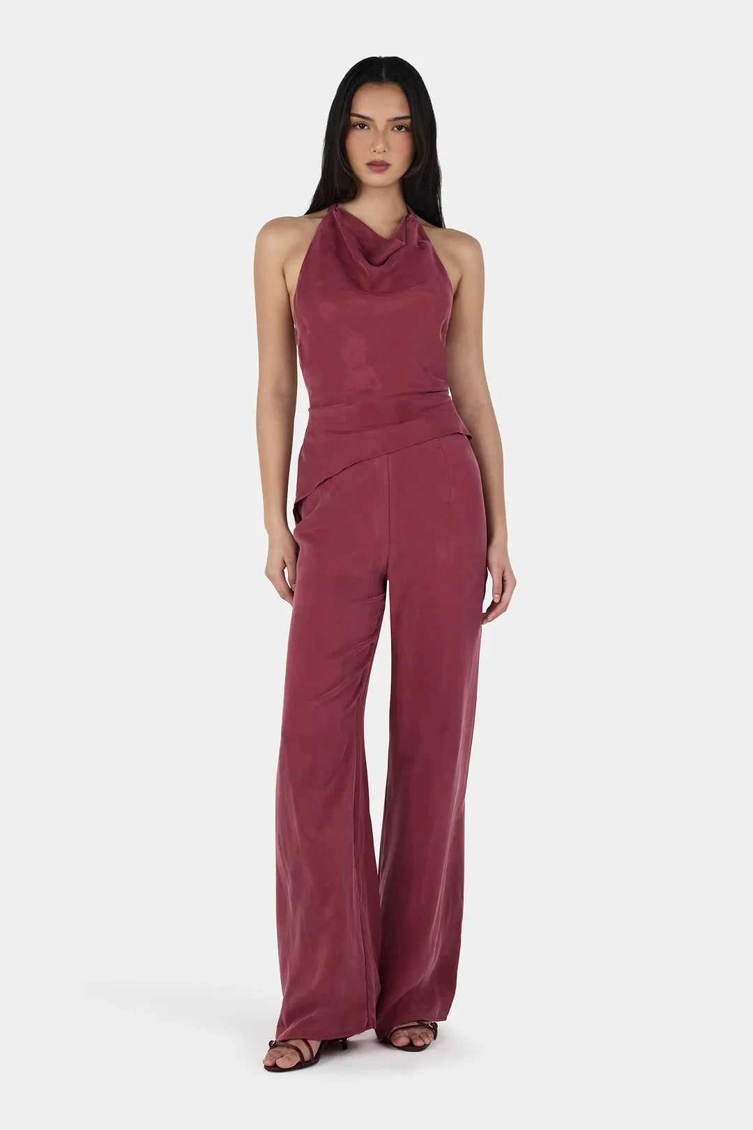 Tailored ease meets everyday elegance.

The Aeris Pant by Ownley is a mid to high-rise style crafted from soft cupro fabric, designed to drape effortlessly over the body. It features a wide-leg silhouette for a relaxed yet elevated look, complemented by a gently elasticated waistband for added comfort. A discreet side-seam invisible zipper keeps the finish clean and streamlined. Pair it with the Iris Halter for a refined matching set.