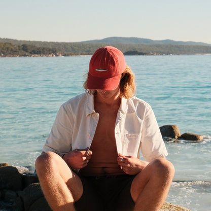 The Sardine Lid by Pallion PT  (Sardinops sagax) is a premium cotton dad cap in a punchy, tomato sauce red. Soft but structured. Relaxed but refined. Embroidered with a hand-drawn sardine, because small fish can still make a splash.