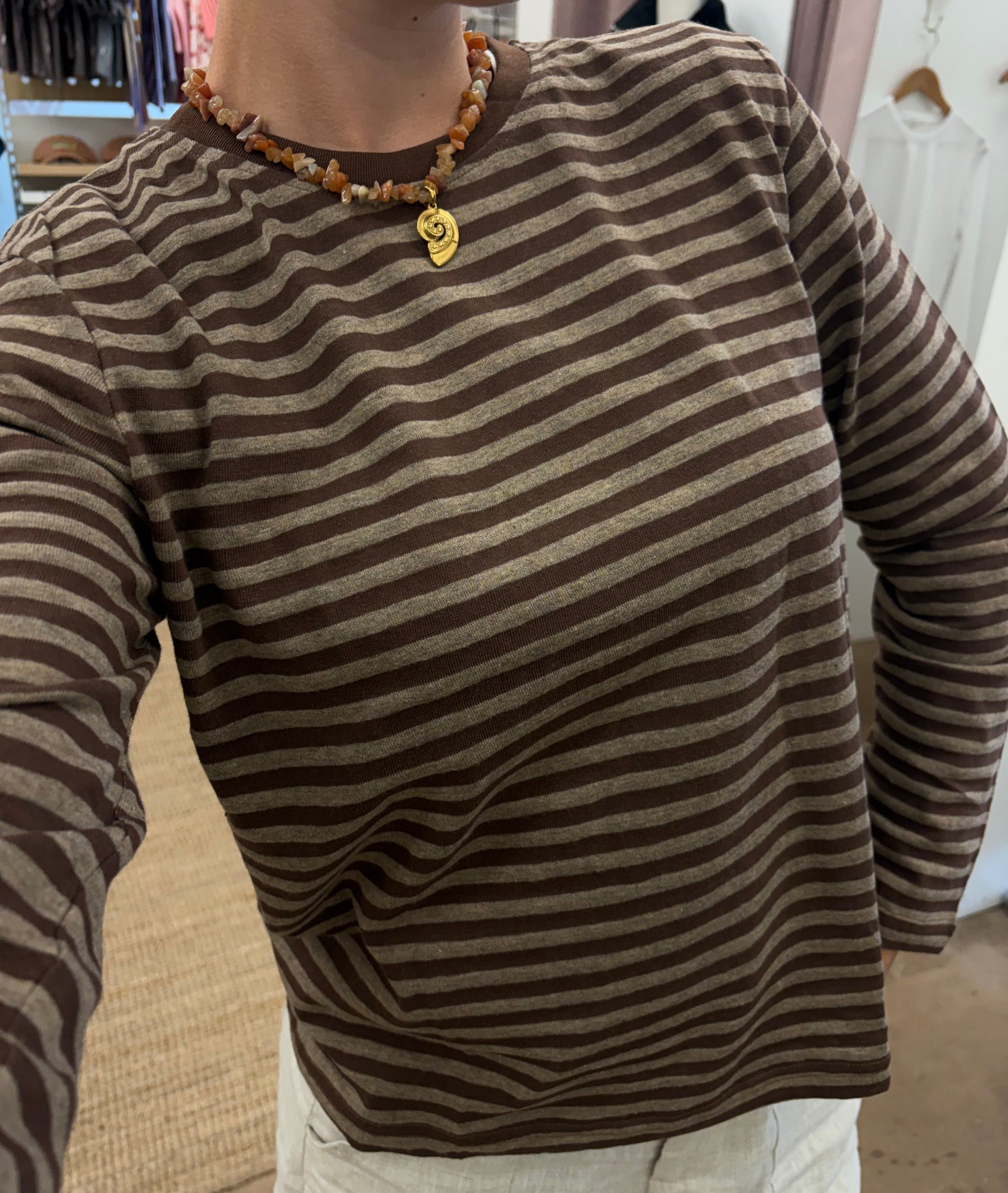 Athena Long Sleeve - Brown - Little Lies 

The Athena Stripe, a long-sleeved basic tee evolved from our best-selling Athens and Rhodes styles, is crafted from a soft cotton/spandex blend with a round neckline, straight hemline, and hemmed long sleeves, offering a buttery feel and perfect stretch for all-day comfort.

FEATURES:

Round neckline
Straight hemline
Hemmed long sleeve
FABRIC: 100% Cotton