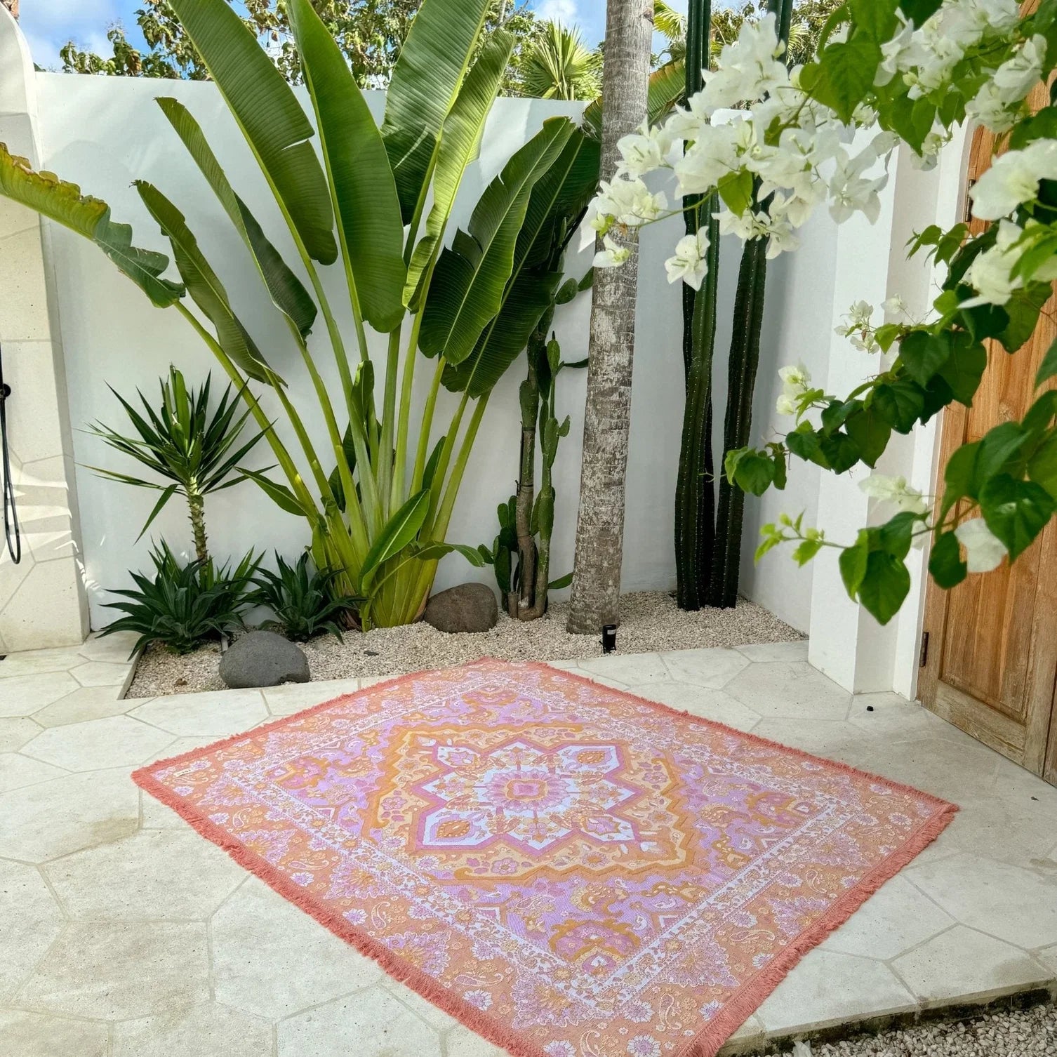 Sundown Picnic Rug - Isla
Created with only the dreamiest sunset hues, Sundown is reminiscent of all of your favourite holiday moments. Endless beach days, the smell of coconut sunscreen, balmy afternoons, ocean swims and sunset picnics with the girls sipping on your favourite fruit cocktail. Created to give you good summer vibes with hues of coral, pinks, yellow, orange and cream.

- Made with 100% cotton 

- One colour tassel trim around the rug

- Extra large picnic rug - approx 190 x 160cm 